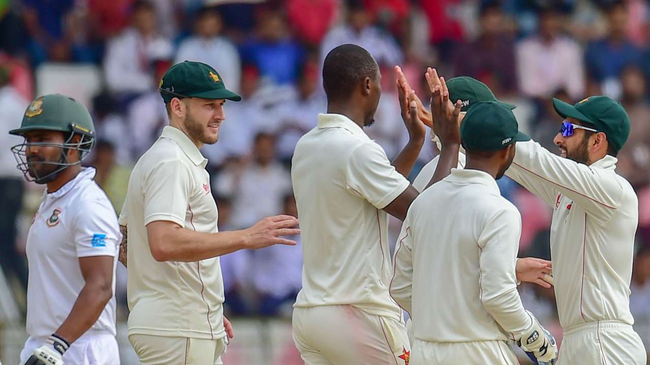 Zimbabwe's players celebrate the wicket of Bangladesh's Imrul Kayes on Sunday