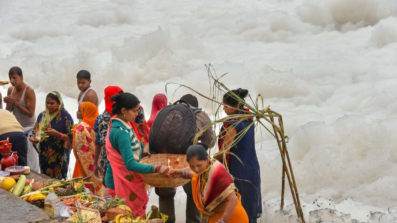 Devotees perform puja