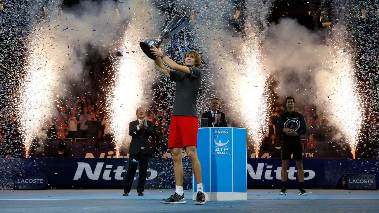 Alexander Zverev celebrates with the trophy after winning the final 