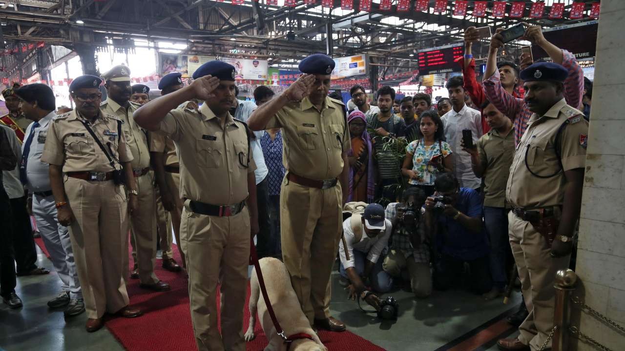 Policemen pay their respects at a memorial