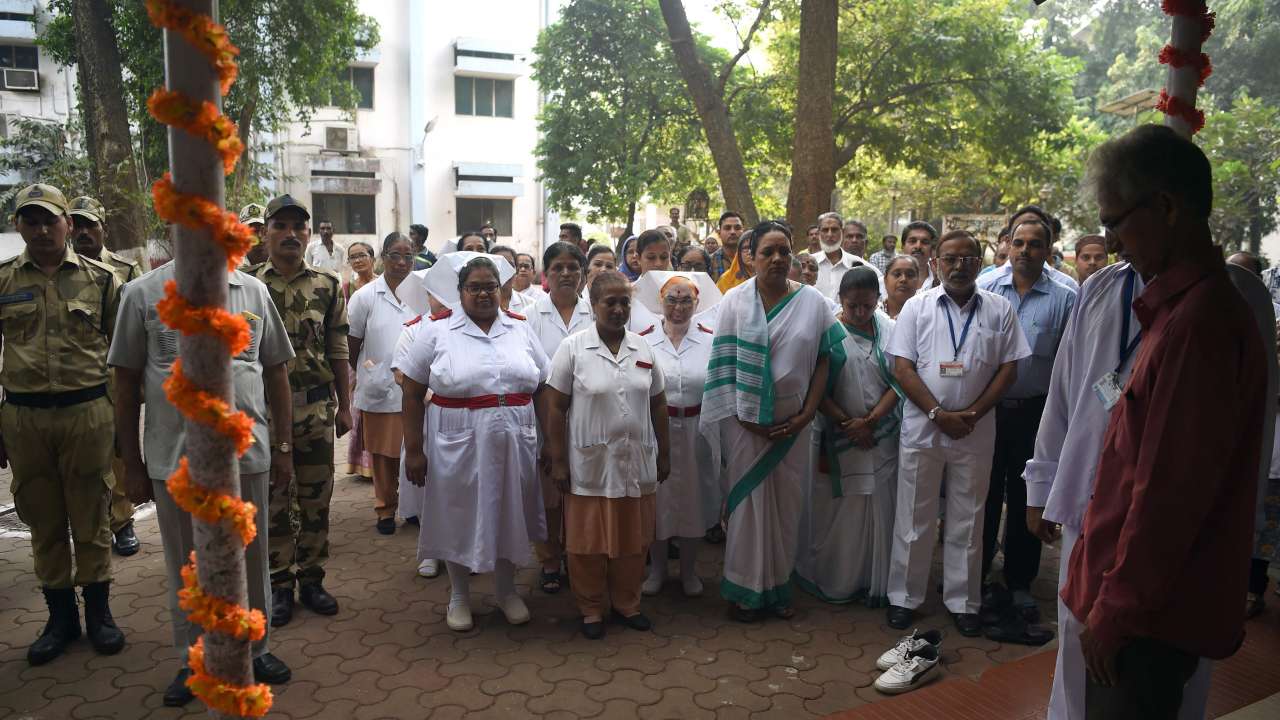 Staff of the Cama Hospital pay respect at memorial