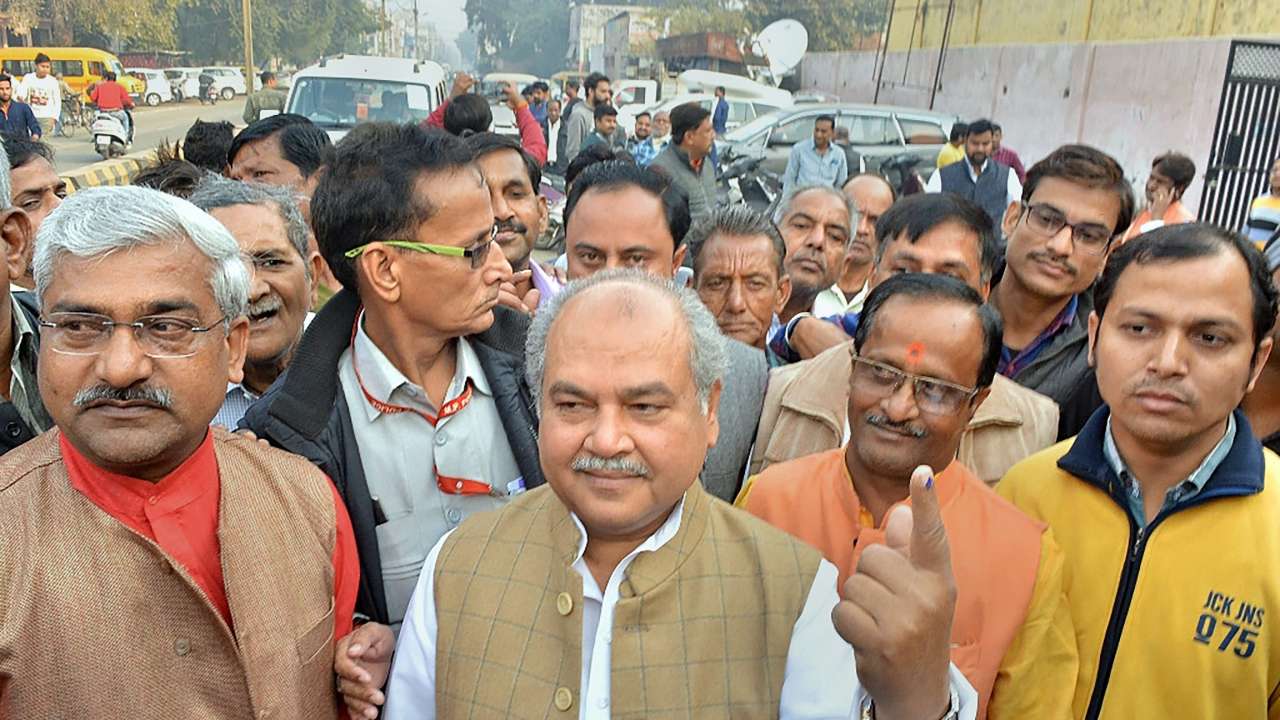 Narendra Singh Tomar shows his ink-marked finger