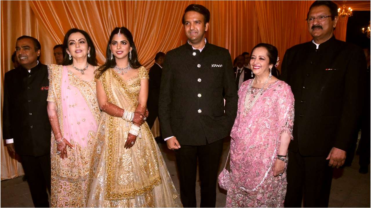 The Ambanis and the Piramals pose for a family picture