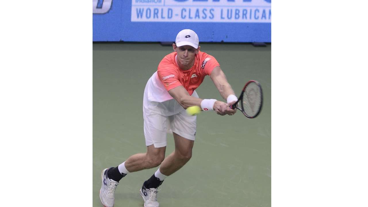 Kevin Anderson returns the ball to Laslo Djere during the Tata Open Maharashtra ATP tennis tournament