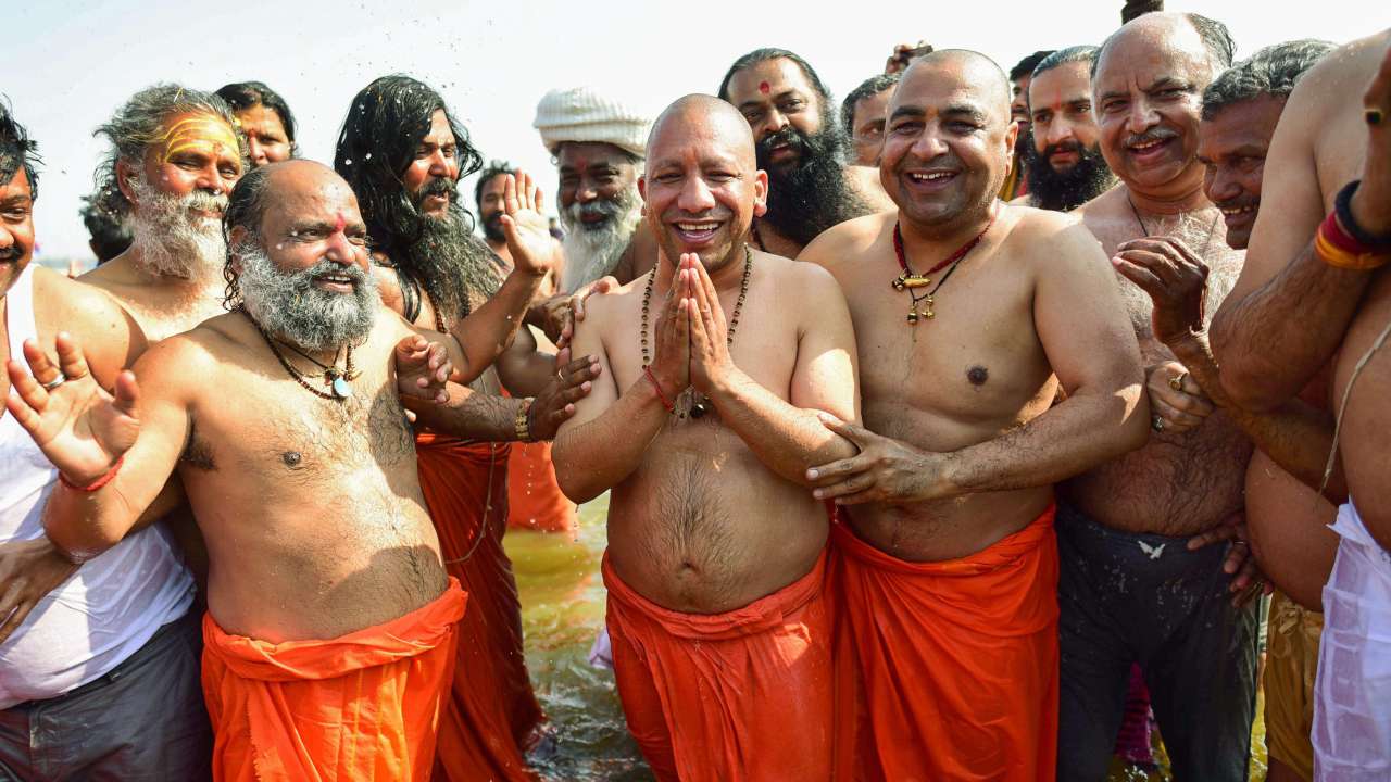(Yogi Adityanath takes a holy dip in the water of River Ganga at Sangam)