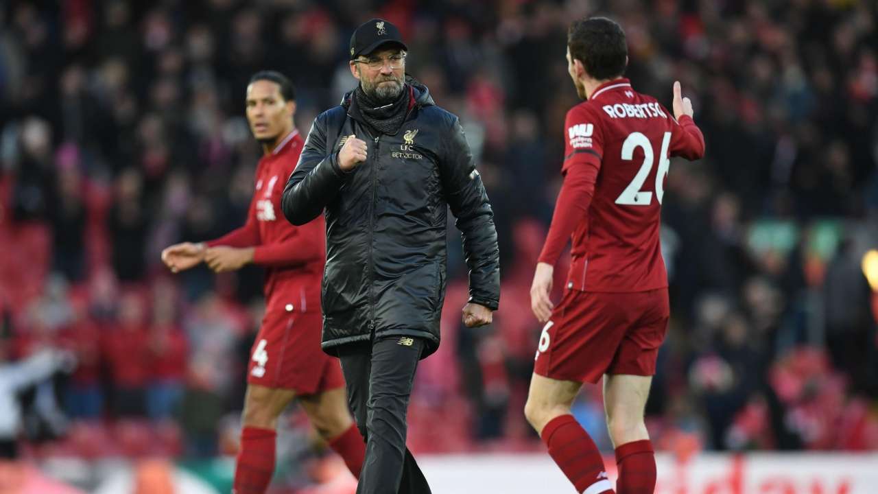 Jurgen Klopp (C) celebrates with Andrew Robertson after match between Liverpool and Bournemouth at Anfield