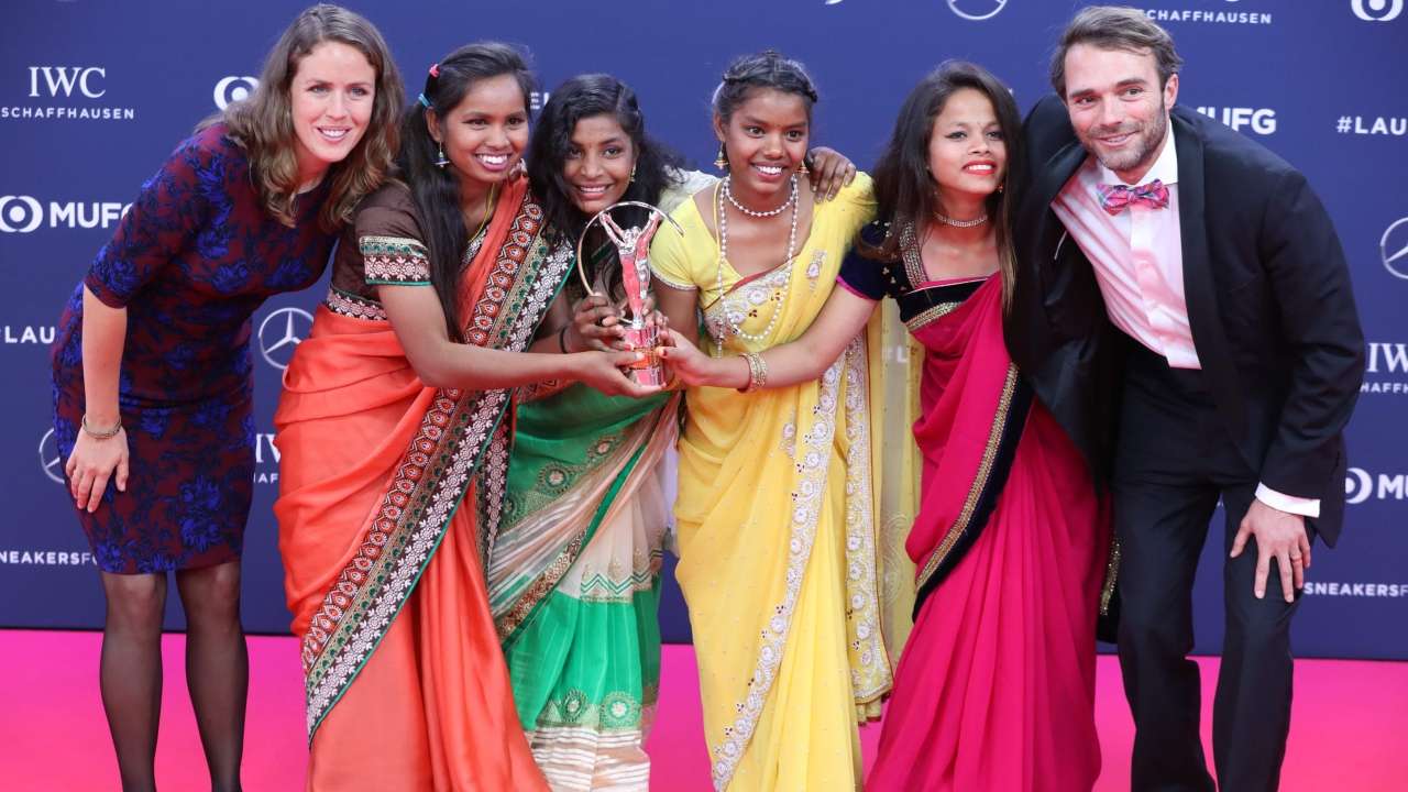 (2L/2R)Neeta Kumari, Radha Kumari, Konika Kumari, Hema Kumari pose with Franz Gastler (R) and Rose Gastler (L)