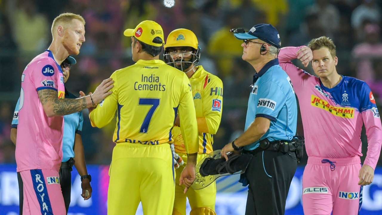 CSK captain M S Dhoni talks to the umpires