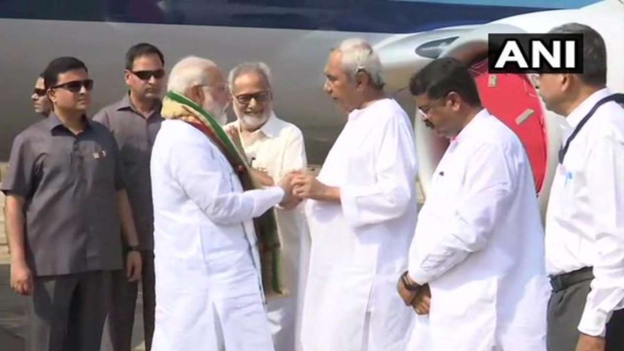 PM Narendra Modi received by Governor Ganeshi Lal and Chief Minister Naveen Patnaik on his arrival to Bhubaneswar