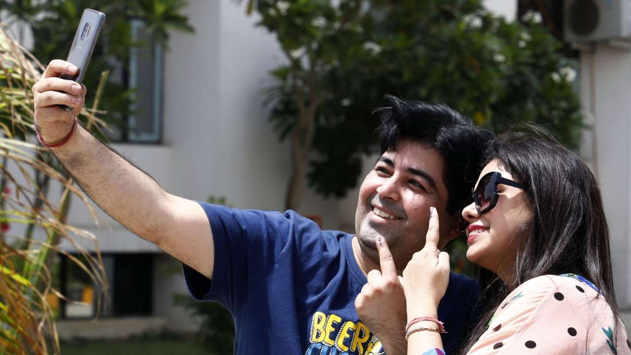 Voters take sefie after casting their vote in a booth in Gurugram
