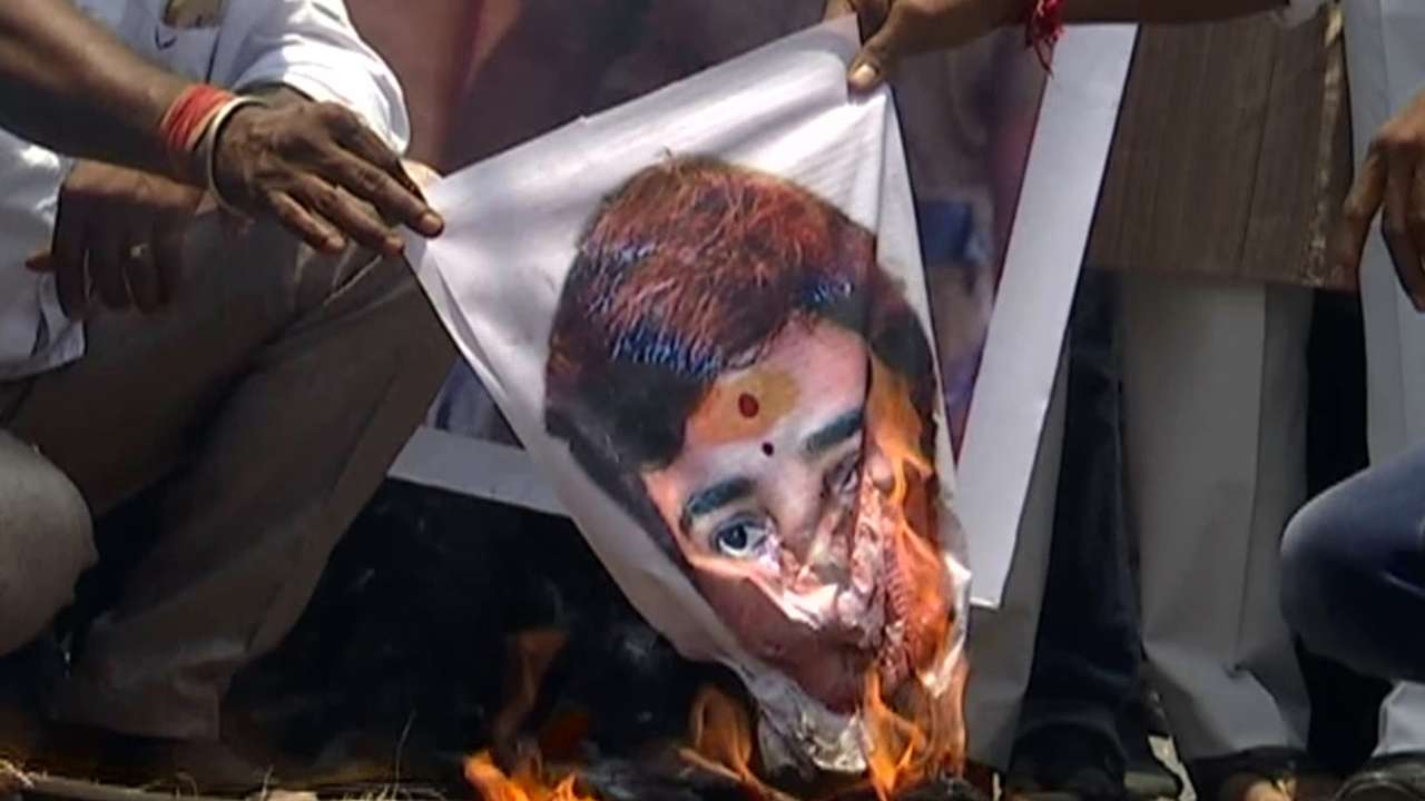 Members of Congress District Unit burns the photograph BJP candidate Sadhvi Pragya Singh Thakur during a protest against her