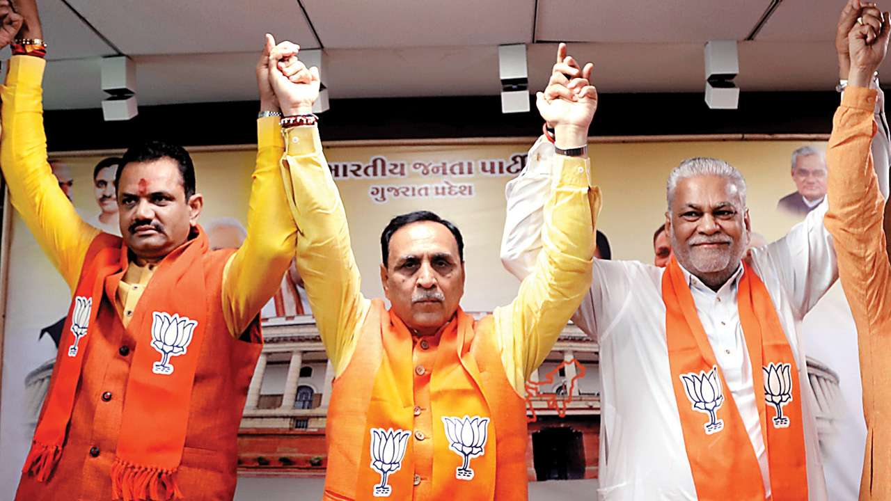 Gujarat CM Vijay Rupani, state party president Jitu Vaghani, and Purshottam Rupala celebrate in Gandhinagar