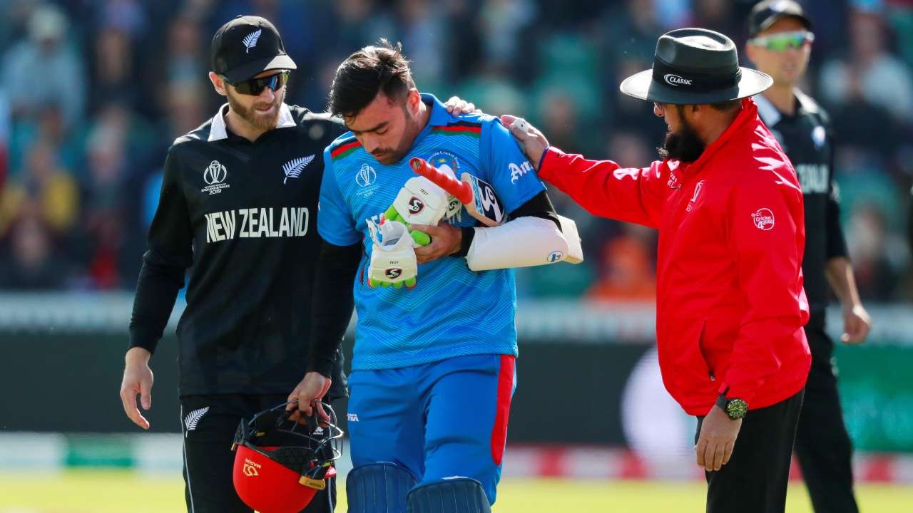Kane Williamson helps Rashid Khan after he is bowled by New Zealands Lockie Ferguson