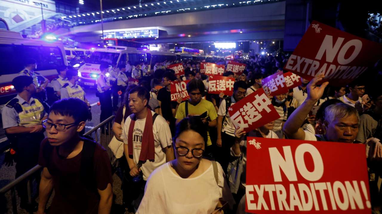 Hong Kong: Demonstrators hold signs during a protest to demand authorities scrap a proposed extradition bill with China.
