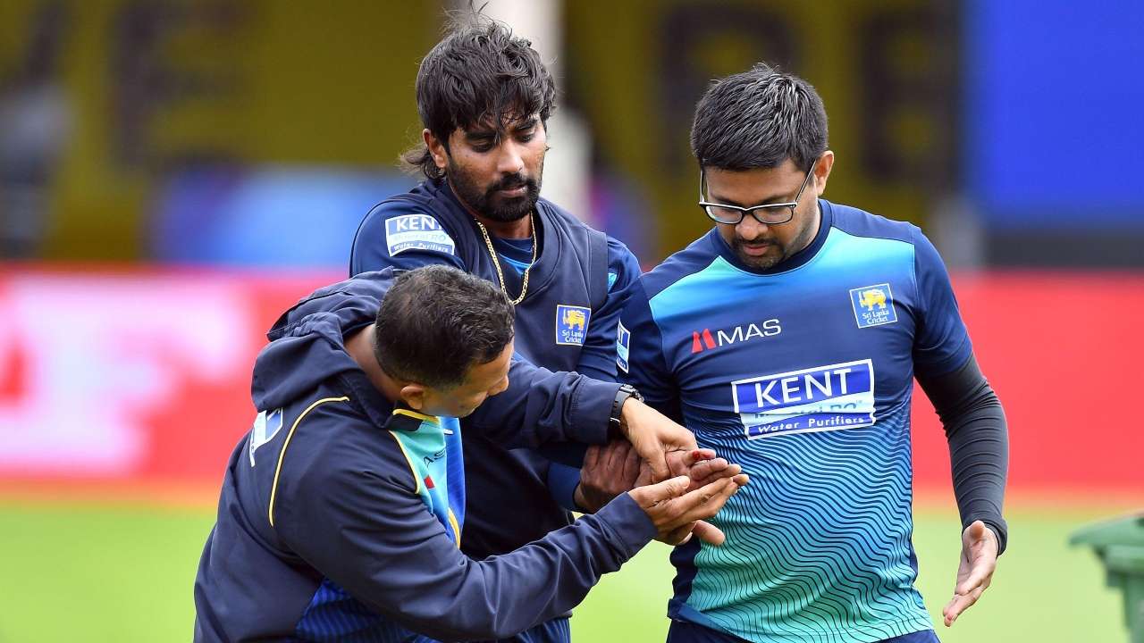 Nuwan Pradeep walks off the field for medical treatment as he gets injured during a training session at Bristol County Ground