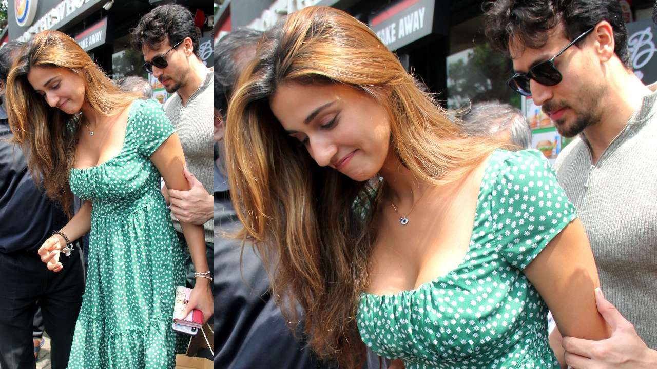 Pics Tiger Shroff Protects Girlfriend Disha Patani From Storm Of