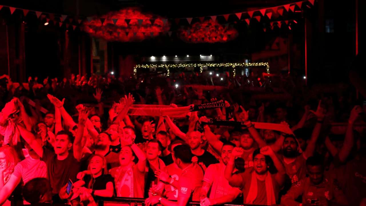 Liverpool fans celebrate after the match