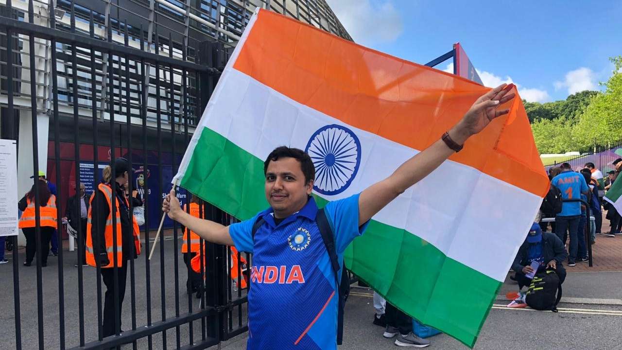 A Fan Making Sure The Flag Is Always High