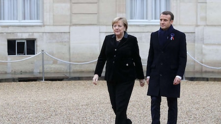 German Chancellor Angela Merkel, French President Macron arrive to attend a lunch