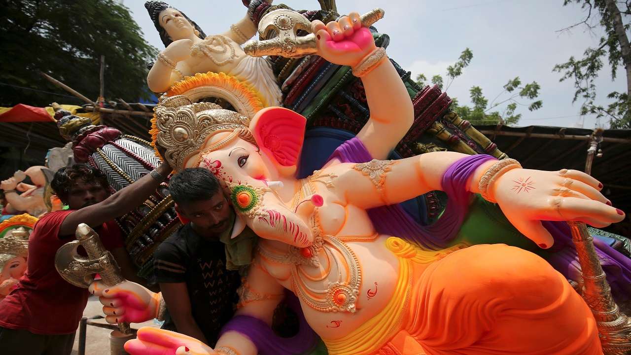 People takes deity of prosperity Lord Ganesha's idol during the festival