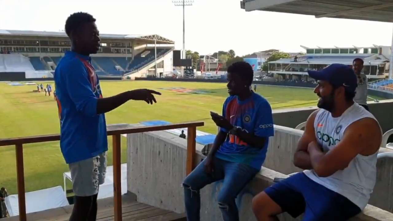 Rohit Sharma with two Jamaican fans