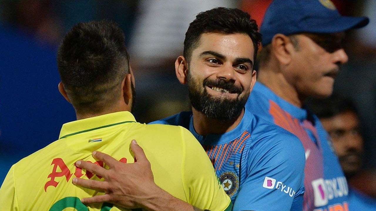 Virat Kohli (R) greets South African player Tabraiz Shamsi 