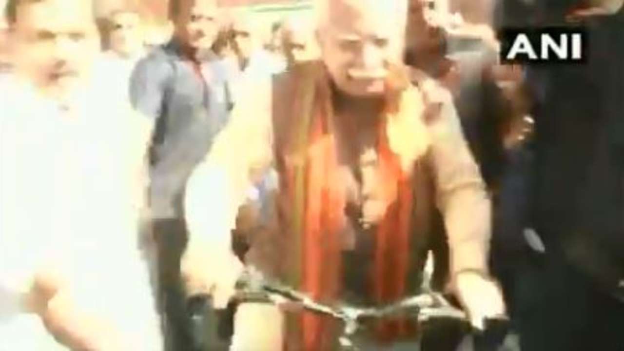 Watch: Haryana Chief Minister Manohar Lal Khattar rides a bicycle to polling booth
