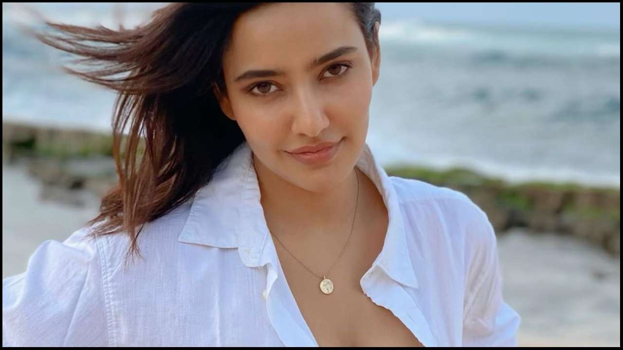 This photo of Neha Sharma flaunting sexy bralette in unbuttoned shirt in  setting internet ablaze