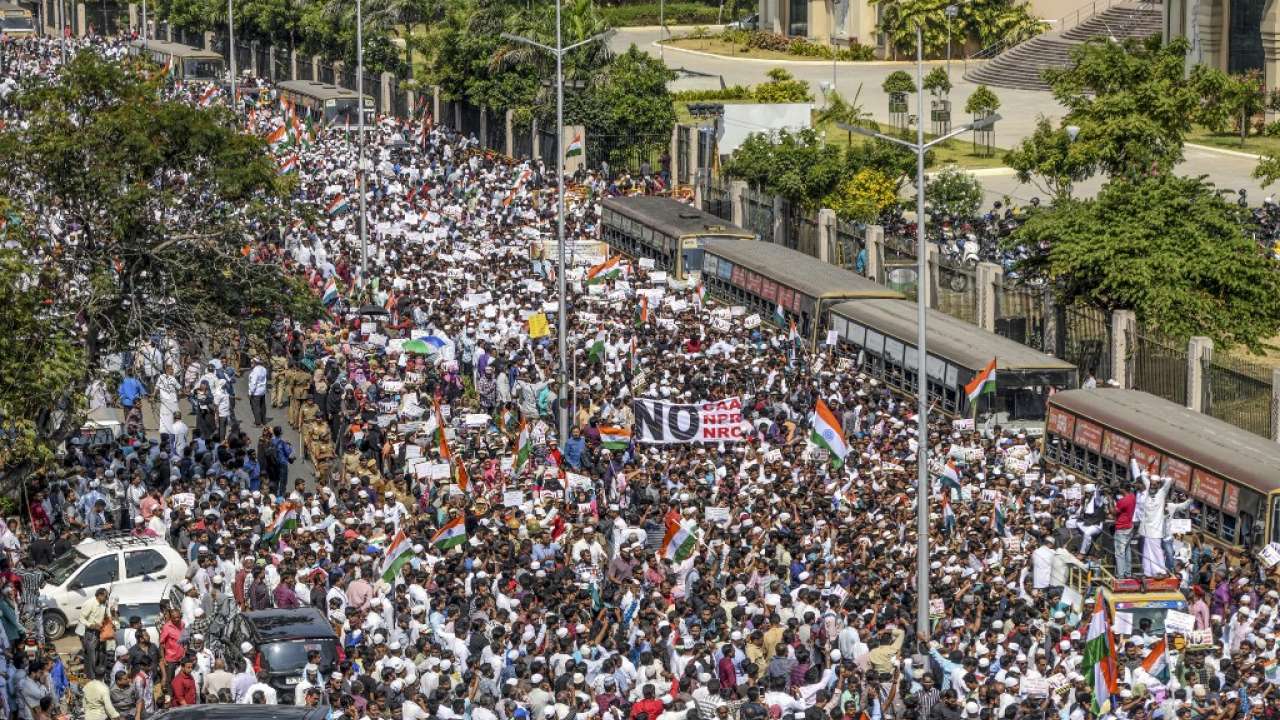 Chennai: Demonstrators hold placards as they wave thr tricolour during a protest organised by various Muslim organisations