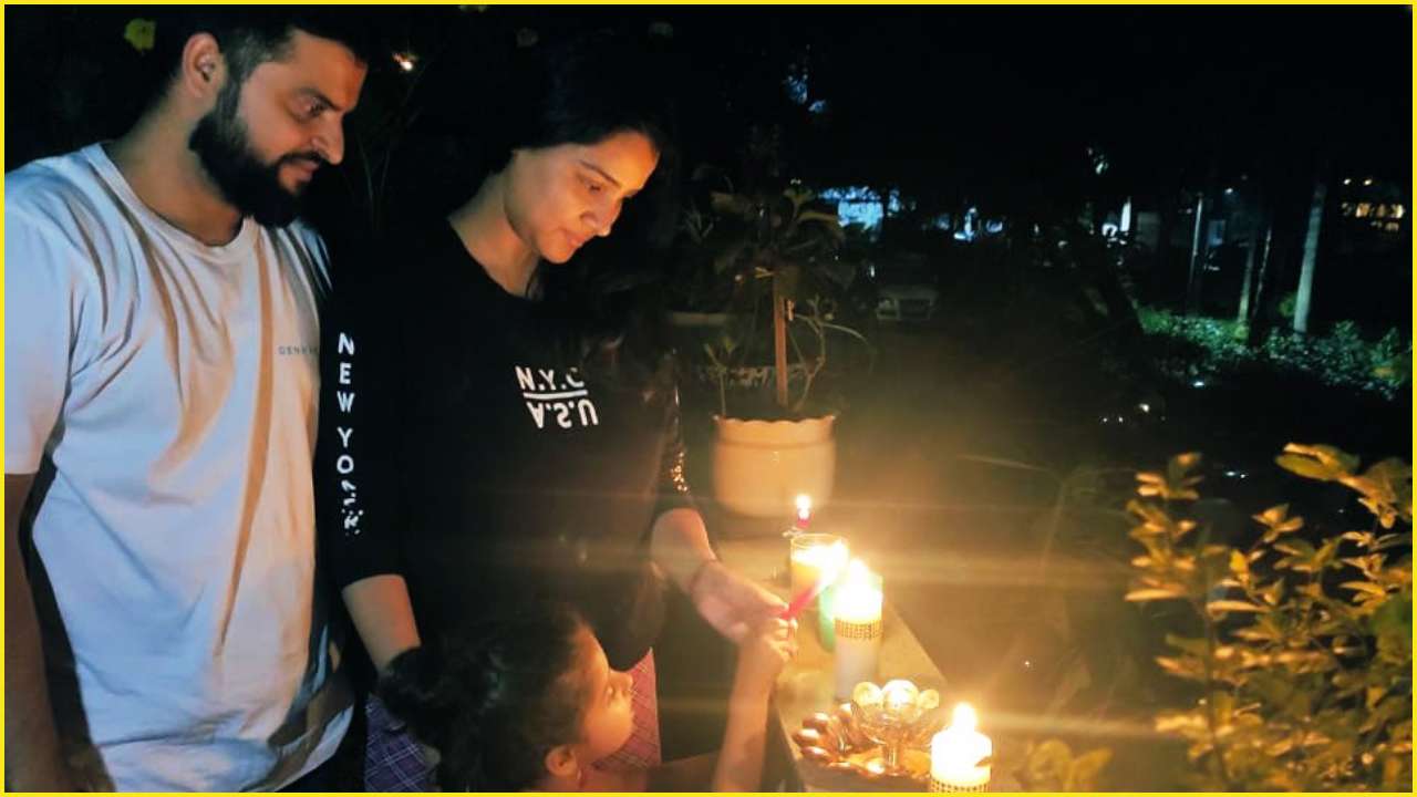 9pm 9 Minutes Suresh Raina Lights Candles With Wife Priyanka And Daughter Gracia In Solidarity To Covid 19 Fighters