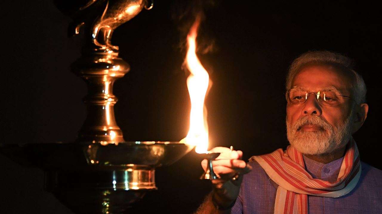 PM Modi lighting the lamp to express solidarity with people of the country in the fight against COVID-19 during 9-minute event