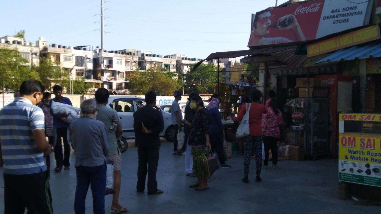 People lined up outside stores in Noida