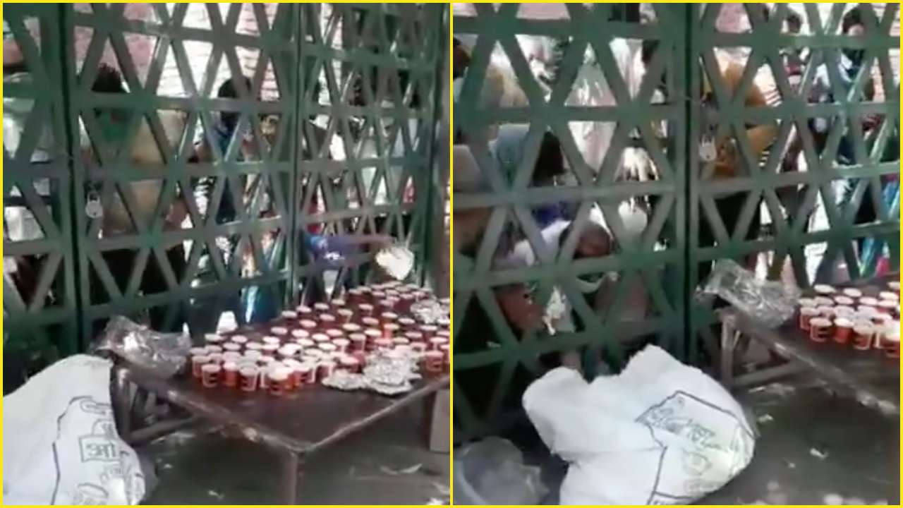People rush to collect essential items at a quarantine centre in Uttar Pradesh