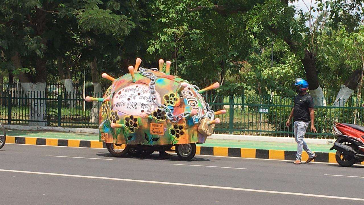 A boy in Bhubaneswar is carrying out awareness campaign on a scooty across the city