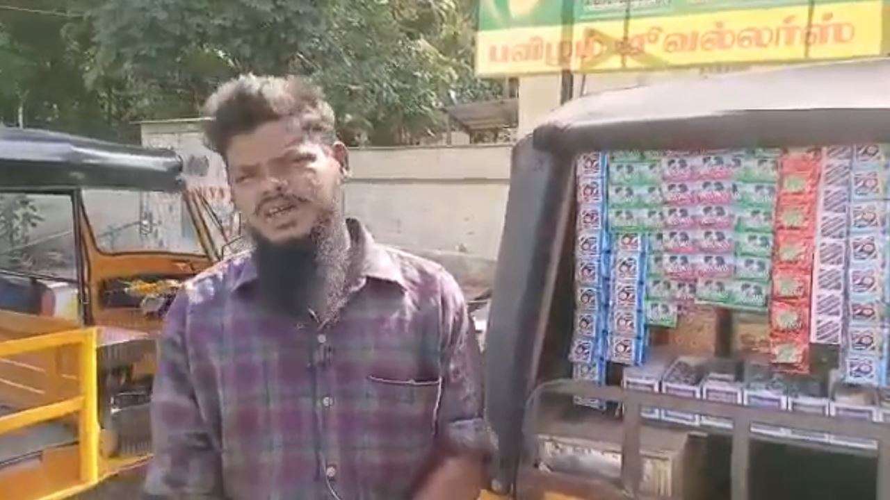 Abdul Samad with the auto-cum-pretty shop