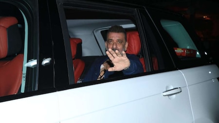 Sanjay Dutt poses for the paps while in his car