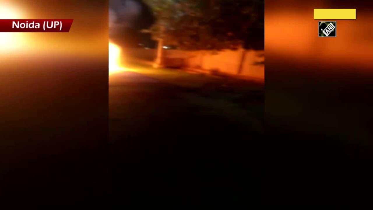 Watch Moving car catches fire in UP’s Noida