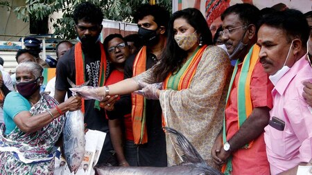 BJP members with actress Namitha distribute free fishes ahead of PM Modi's b'day in Chennai