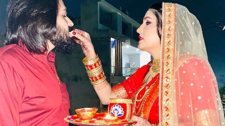 Sapna Chaudhary feeds her husband sweets