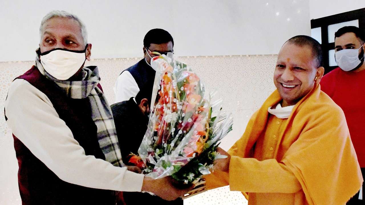 Uttar Pradesh Chief Minister Yogi Adityanath (right).