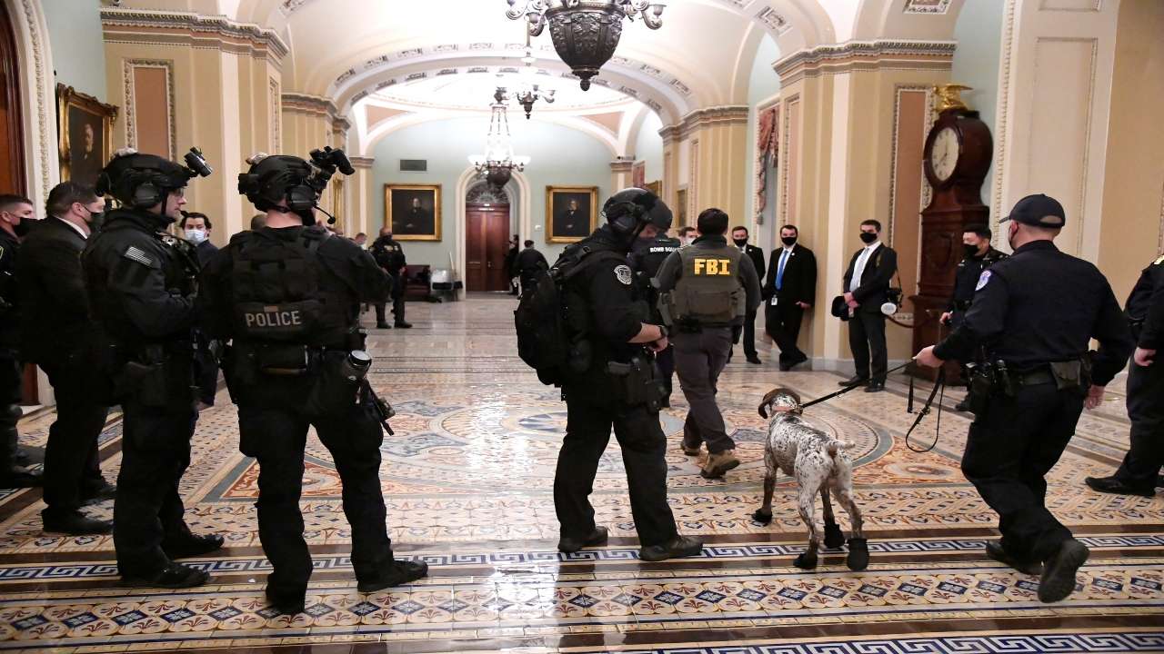 US Capitol riots: Man pictured carrying Speaker Nancy Pelosi's lectern ...