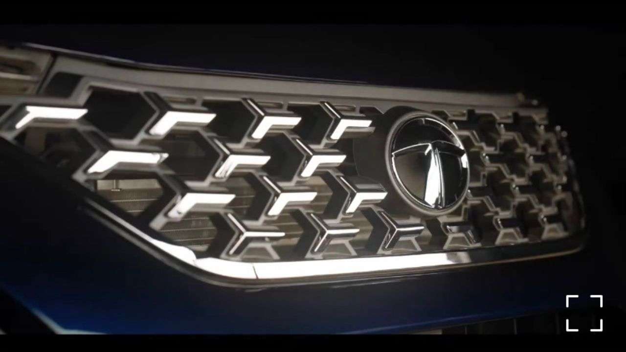 Chrome-studded signature tri-arrow front grille