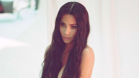 Kim Kardashian flaunts her long locks while posing nude