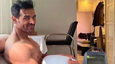 John Abraham is ''waiting for wardrobe'', poses with just a pillow