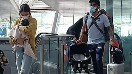 Virat Kohli and Anushka Sharma snapped at Pune airport with daughter Vamika