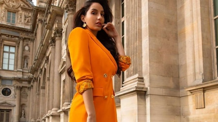 Nora Fatehi shines in an orange outfit