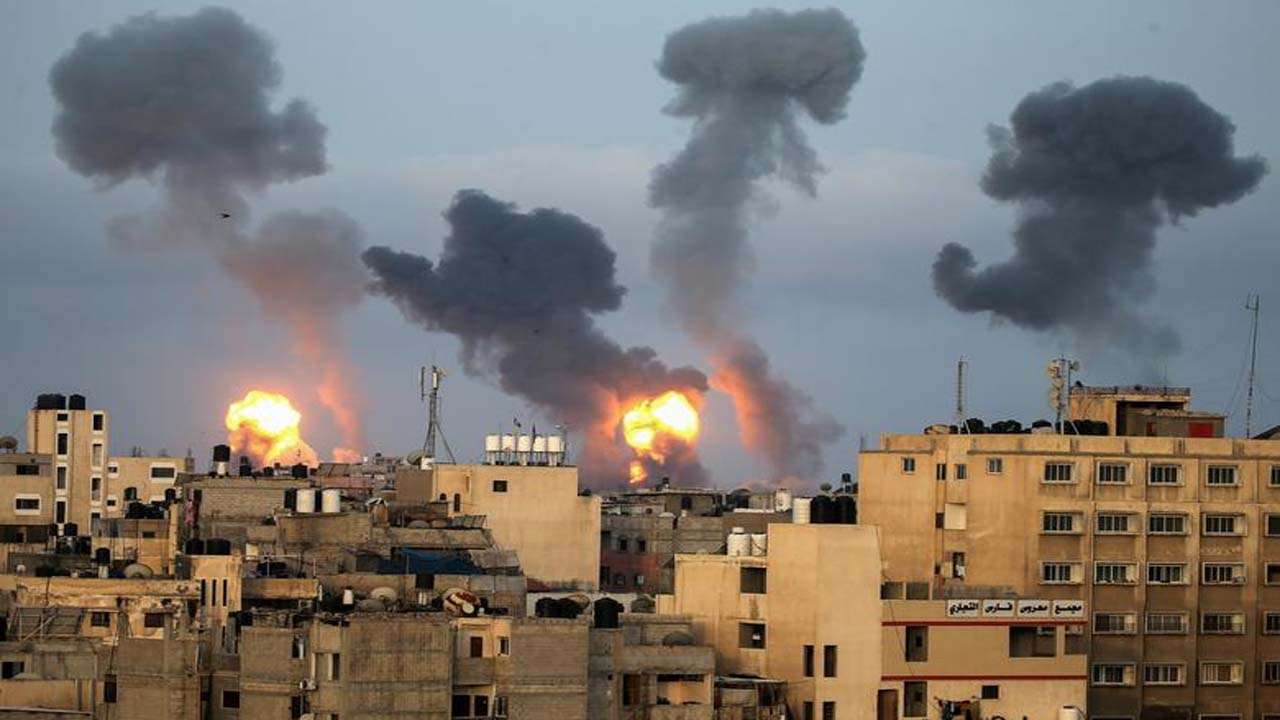 Flames and smoke rise during Israeli air strikes 
