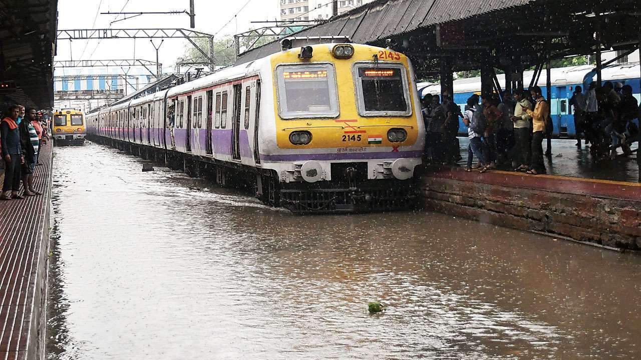 Mumbai Local Train News Heavy Rainfall Hits Services On Several Routes