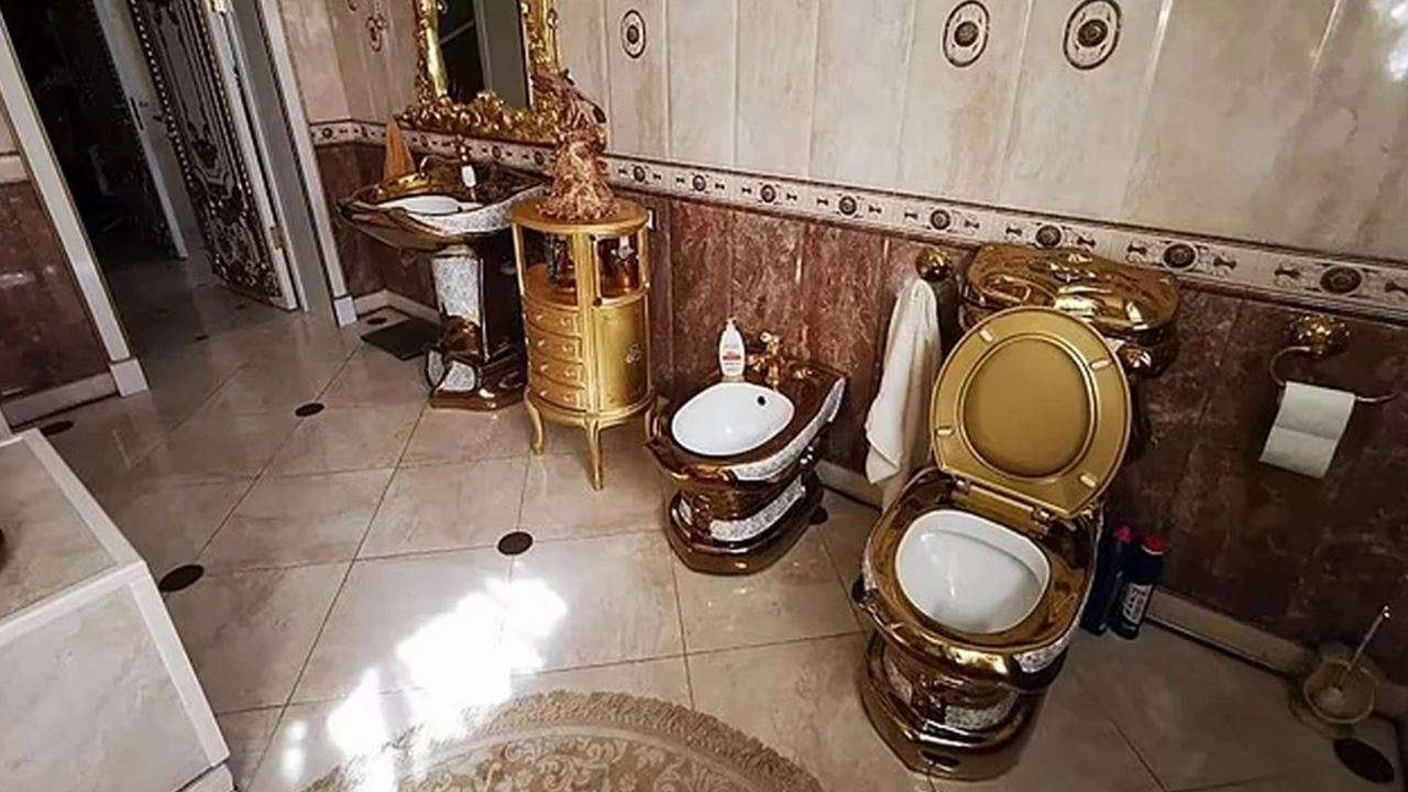 Video: Golden toilet, kitchen, halls found in cop's lavish mansion