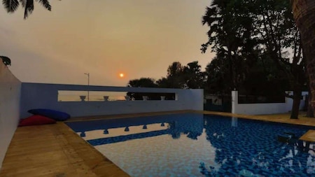 The swimming pool offers a stunning view of the sea